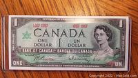 Front side of the 1967 Canadian Centennial One Dollar Bill showing Queen Elizabeth II and the year 1967.