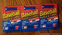 Three sealed 1989 Donruss Baseball Puzzle & Cards packs in red and blue packaging, featuring Warren Spahn puzzle and MVP bonus baseball cards.