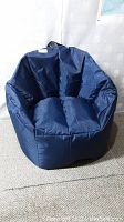 Front angle view of the navy blue Big Joe beanbag chair showing cushioned seat and backrest.