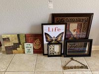 All artwork and brass keyholder laid out against wall, showing size and styles.