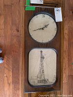 Full front view of the rectangular oil derrick wall clock showing both clock face and drawing panel.