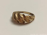 Front view of ring showing twisted leaf pattern