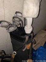 Ping Zing 2 irons in black stand bag with knit headcover