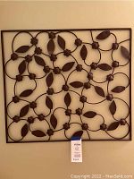 Square wrought iron wall hanging with intertwined floral and leaf design, 34x30 inches