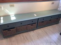 Two storage benches side by side against wall