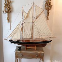Full view of wooden Bluenose model on stand