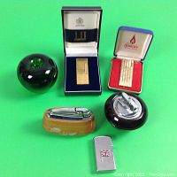 Group view of six lighters on green background