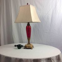 Full view of lamp with silk shade and green apple reference