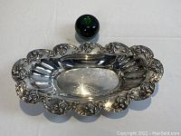 Top-down view of serving dish with green apple for scale.