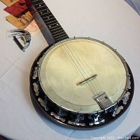 Overhead view of banjo body showing skin head, tension hoop and bracket hooks