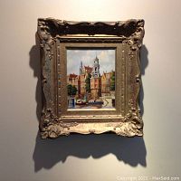 Full view of painting and ornate gold frame against wall