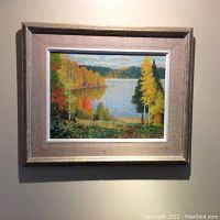 Full view of framed oil painting hanging on wall