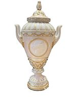 Front view of lidded porcelain urn vase showing overall shape and gilt decoration