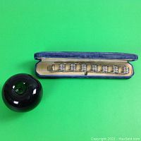 Bracelet in velvet box with green reference object