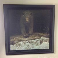 Full front view of framed print showing bear image and black frame.