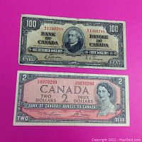 Front view of both banknotes showing portraits and serial numbers