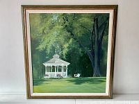 Front view of oil painting showing gazebo and surrounding trees in original frame