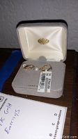 Pair of 14K gold earrings with pearls inside grey velvet case, white satin lining, 14K marked, price tag attached.