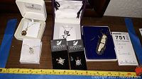 Lot contents showing all pieces including pendants and Swarovski pins with ruler for scale.