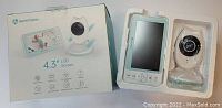HeimVision HM132 baby monitor and camera in original packaging, showing the 4.3 inch LCD screen and camera unit with controls beneath.