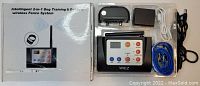 Intelligent 2-in-1 Dog Training & Outdoor Wireless Fence System components displayed alongside box, including transmitter, remote collar, power adapters, and cables.