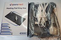Photo of Paramed King Size Heating Pad box and the heating pad itself sealed in plastic with white control cord and controller.