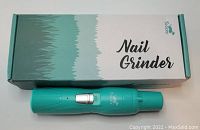 Photo of a turquoise Toozey nail grinder for large dogs and cats, showing the grinder and its box.