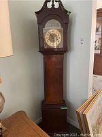 Full view of Forestville grandfather clock showing decorative top and clock face.