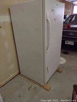 Front-left perspective of freezer showing exterior and handle