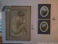 Overall view of charcoal nude drawing and two oval landscape paintings on wall
