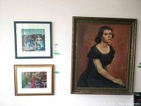 Oil painting and two framed prints hung together on wall