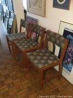 Four chairs angled view showing frames and upholstery pattern