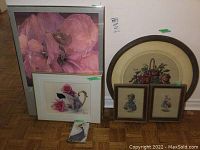 All five framed pieces arranged on floor against wall showcasing size and style variety.