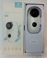 Image showing the Heimvision HMD2 battery powered security camera in its original white retail box with the camera securely placed in molded packaging.
