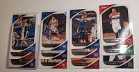 Twelve Panini Absolute Memorabilia 2020-2021 NBA rookie basketball cards laid out for display.