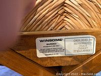 Close-up of Winsome label showing model and material details.