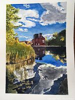 Photo of original watercolour painting showing Toronto BrickWorks with reflections on water, blue sky, and green foliage, unframed on art paper.
