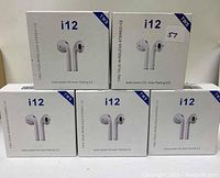 Five boxed i12 wireless stereo earbuds arranged in two rows, showing the front of each box with images of the earbuds and product features.