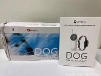 Photo shows GoodBoy Dog Training Collar original box and user guide manual.