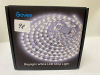 Photo of Govee Daylight White LED Strip Light packaging showing rolled LED strip inside a black box with product image and Govee logo.