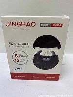Front of product box showing Jinghao rechargeable BTE hearing aid model JH-D26 with details on charging and usage time.