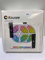 Front view of Kousee LED strip lights packaging showing multi-color LED coils inside the box and branding details