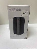 Photo of the M68 Portable Speaker in its original white box packaging showing the front image and model number.