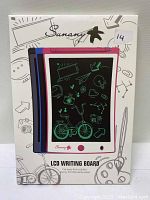 Photo showing the Sunany branded packaging with images of three colored LCD writing boards (red, black, blue) for kids with icons displayed on screen.