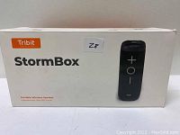 Box of Tribit StormBox portable wireless speaker showing product name and image of speaker.