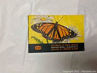 Yellow softcover album book with Monarch butterfly and title indicating Butterflies of North America Brooke Bond Album No. 8