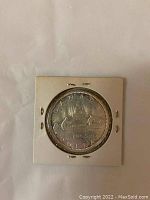 Obverse side featuring a caribou and the text "CANADA 1965 DOLLAR".