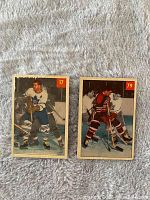Front view of two 1954-55 Parkhurst hockey cards showing Harry Watson (#17) in white Toronto Maple Leafs jersey and Lou Jankowski (#79) in black Chicago Black Hawks jersey.