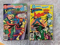 Front covers of two DC Comics Presents comic books featuring Superman in action against villains including Elongated Man and Green Lantern.