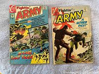 Front cover view of two vintage Fightin' Army comics, showing action-packed illustrated covers